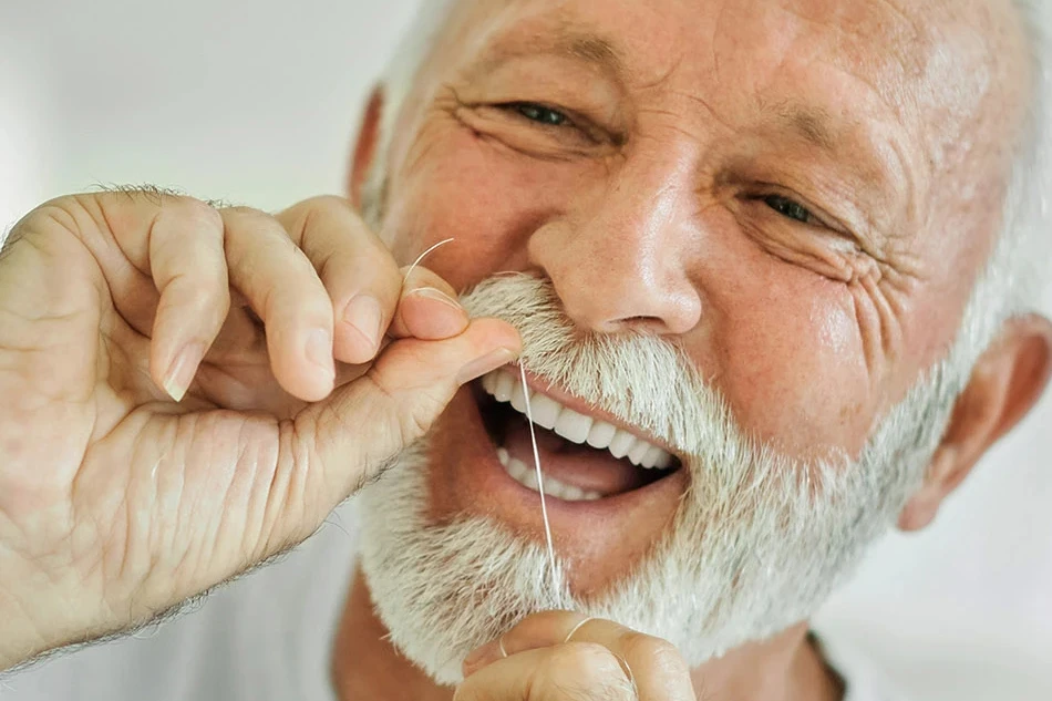 Hygienist Jelena flossing bleeding gums